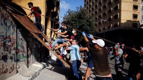 Photo of Mock gallows, tear gas and flying rocks. Beirut erupts in violent protest days after blast